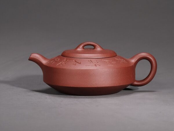 Man Sheng Flat Stone Teapot