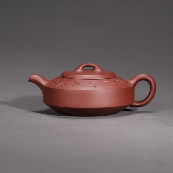 Man Sheng Flat Stone Teapot