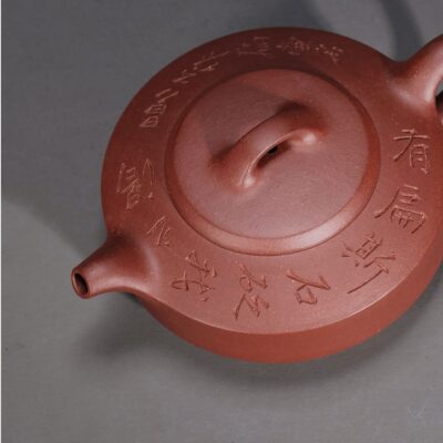 Man Sheng Flat Stone Teapot