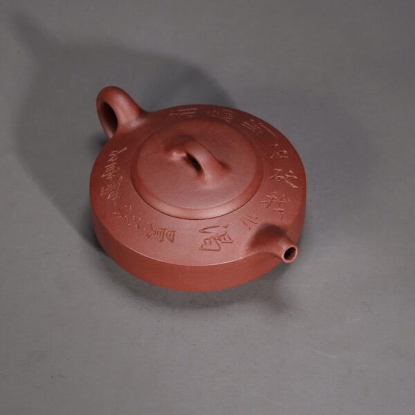 Man Sheng Flat Stone Teapot