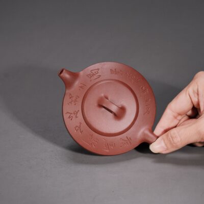 Man Sheng Flat Stone Teapot